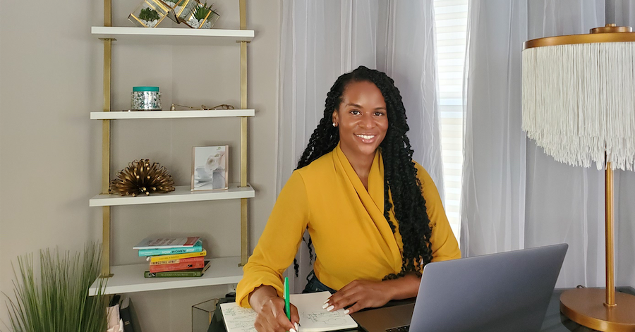 Capital One associate Mikela sits at her remote desk